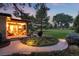 Landscaped backyard with patio, walkway, and golf course view at 43 Fairway Ln, Littleton, CO 80123