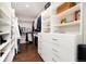 Bright walk-in closet with ample shelving and hanging space at 43 Fairway Ln, Littleton, CO 80123