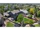 Aerial view of a backyard featuring a lawn, trampoline, shed, deck, and privacy fence at 879 Quintana Ln, Erie, CO 80516