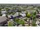 Aerial view of home with fenced backyard featuring lush lawn and mature trees in a Gathering-friendly neighborhood at 879 Quintana Ln, Erie, CO 80516