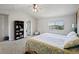 Bright bedroom with a large window, providing abundant natural light and views of the surrounding neighborhood at 879 Quintana Ln, Erie, CO 80516