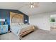 Bright bedroom with a decorative headboard, and light-filled interiors from a large window, offering a serene retreat at 879 Quintana Ln, Erie, CO 80516