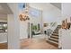 Grand foyer featuring high ceilings, hardwood floors, and a staircase at 879 Quintana Ln, Erie, CO 80516