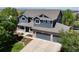 Stunning two-story home with a three-car garage, beautiful landscaping, and mountain views at 879 Quintana Ln, Erie, CO 80516