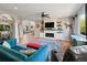 Open-concept living room with fireplace and plenty of natural light at 879 Quintana Ln, Erie, CO 80516