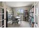 Home office with carpet, built-in bookshelves and a large window at 879 Quintana Ln, Erie, CO 80516