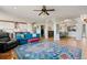 Bright open concept kitchen and living room with hardwood floors at 879 Quintana Ln, Erie, CO 80516