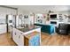 Open floor plan view from the kitchen to the fireplace in living room at 879 Quintana Ln, Erie, CO 80516