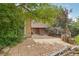 Spacious backyard featuring a large patio area surrounded by lush landscaping at 2173 S Ouray St, Aurora, CO 80013