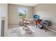 Neutral carpeted bedroom with a window, perfect for a home office or guest room at 2173 S Ouray St, Aurora, CO 80013