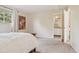 Bright bedroom boasts natural light, a serene atmosphere, and convenient access to the en-suite bathroom at 2173 S Ouray St, Aurora, CO 80013