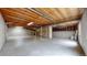 Unfinished basement featuring concrete flooring, exposed ceiling beams, and plenty of open space at 2225 S Lima Ct, Aurora, CO 80014