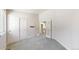 Spacious bedroom featuring neutral carpet and French doors that lead to the staircase at 2225 S Lima Ct, Aurora, CO 80014