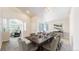 Elegant dining room with ample seating, neutral colors, and archway to living room at 2225 S Lima Ct, Aurora, CO 80014