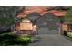 Inviting home exterior showcasing warm lighting and a well-kept lawn at dusk at 2225 S Lima Ct, Aurora, CO 80014