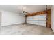 Clean and spacious garage with a large garage door, concrete floor, and ample room for parking and storage at 2225 S Lima Ct, Aurora, CO 80014