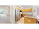 Contemporary kitchen with stainless steel appliances, granite countertops, and warm wood cabinetry at 2225 S Lima Ct, Aurora, CO 80014