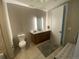 Contemporary bathroom with dual vanity, modern lighting, and neutral color scheme at 4200 W 17Th Ave # 411, Denver, CO 80204