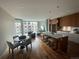 Open-concept living space boasts a kitchen island with bar seating and dining area at 4200 W 17Th Ave # 411, Denver, CO 80204