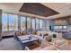 Spacious living area featuring a fireplace, large windows, and comfortable seating arrangements at 4200 W 17Th Ave # 411, Denver, CO 80204