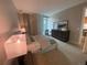 Cozy main bedroom with a comfortable bed, bedside lamps, and dresser at 4200 W 17Th Ave # 411, Denver, CO 80204