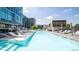 Inviting outdoor pool with lounge chairs, umbrellas, and clear blue water, perfect for relaxation at 4200 W 17Th Ave # 411, Denver, CO 80204