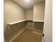 A walk-in closet with carpet and white shelving at 4200 W 17Th Ave # 411, Denver, CO 80204