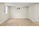 Unfinished basement space with wood-look floors offers potential for customization at 5708 S Galena St, Greenwood Village, CO 80111