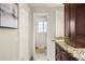 Ensuite bathroom featuring tiled floors, granite counters, and modern cabinets at 5708 S Galena St, Greenwood Village, CO 80111