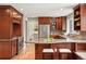 Modern kitchen with stainless steel appliances, wood cabinets, and granite countertops at 5708 S Galena St, Greenwood Village, CO 80111