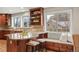 Spacious kitchen featuring a breakfast bar, granite countertops, and a window seat at 5708 S Galena St, Greenwood Village, CO 80111