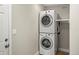 Convenient laundry room featuring a stacked washer and dryer unit to maximize space at 5708 S Galena St, Greenwood Village, CO 80111