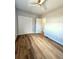 Cozy bedroom with hardwood floors, a ceiling fan, and a closet at 1435 N Uinta St, Denver, CO 80220