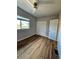 Bright bedroom features hardwood floors, a ceiling fan, and a closet at 1435 N Uinta St, Denver, CO 80220