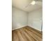 Bright bedroom with hardwood floors and neutral walls perfect for personalization at 1435 N Uinta St, Denver, CO 80220