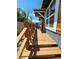 Inviting deck showcasing natural wood, providing a welcoming entrance to the home at 1435 N Uinta St, Denver, CO 80220