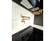 Close-up of a gourmet kitchen's pot filler faucet and sleek induction cooktop at 1435 N Uinta St, Denver, CO 80220