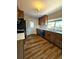 Updated kitchen featuring wood cabinets, stainless steel appliances, and a bright window at 1435 N Uinta St, Denver, CO 80220
