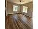 Inviting living area features hardwood floors and natural light from large windows at 1435 N Uinta St, Denver, CO 80220