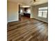 Spacious living room showcasing open layout, wood floors, and direct kitchen access at 1435 N Uinta St, Denver, CO 80220