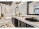 Renovated bathroom features a dual vanity with framed mirrors, tiled backsplash, and modern fixtures at 1737 Jules Ct, Highlands Ranch, CO 80126