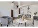 Open-concept living area with a dining area, light-filled and modern interior design at 1737 Jules Ct, Highlands Ranch, CO 80126