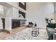 Contemporary living room showcasing a modern fireplace, open shelving, and stylish decor at 1737 Jules Ct, Highlands Ranch, CO 80126