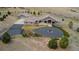 Aerial view of a spacious home featuring a circular driveway, an attached garage, and a well-maintained yard at 5881 Deer Meadow Trl, Golden, CO 80403