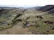 Expansive aerial shot showcases the estate's prime location amidst rolling hills and beautiful natural surroundings at 5881 Deer Meadow Trl, Golden, CO 80403