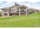 Expansive backyard featuring a large patio and deck, perfect for outdoor entertaining at 5881 Deer Meadow Trl, Golden, CO 80403