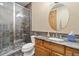 Modern bathroom featuring a glass-enclosed shower and vanity with granite counters and vessel sink at 5881 Deer Meadow Trl, Golden, CO 80403