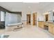 Bright bathroom with a large glass block shower, granite counters, and dual sinks at 5881 Deer Meadow Trl, Golden, CO 80403