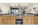 Bathroom featuring double sinks with granite counters and arched glass block wall at 5881 Deer Meadow Trl, Golden, CO 80403