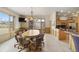 Bright dining room with backyard views, wood trim, and a nearby breakfast nook at 5881 Deer Meadow Trl, Golden, CO 80403